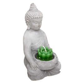 Small Buddha statue with candles in lotus shape